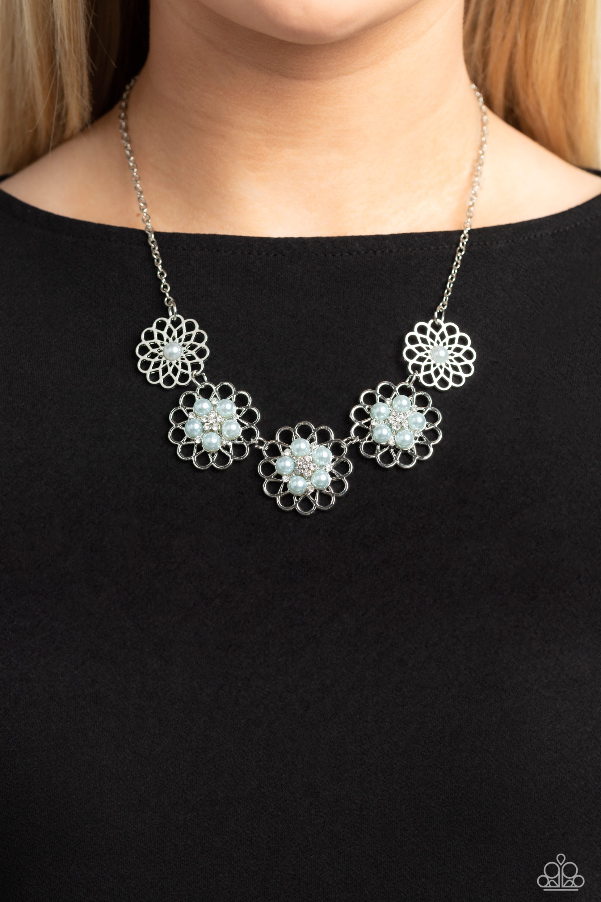 Paparazzi Accessories Mandala Mosaic - Blue Gleaming silver flowers with airy filigree petals are dotted with dainty white rhinestones and Skylight pearl centers for a refined design. The Skylight pearls and dainty white rhinestones form into a smaller fl