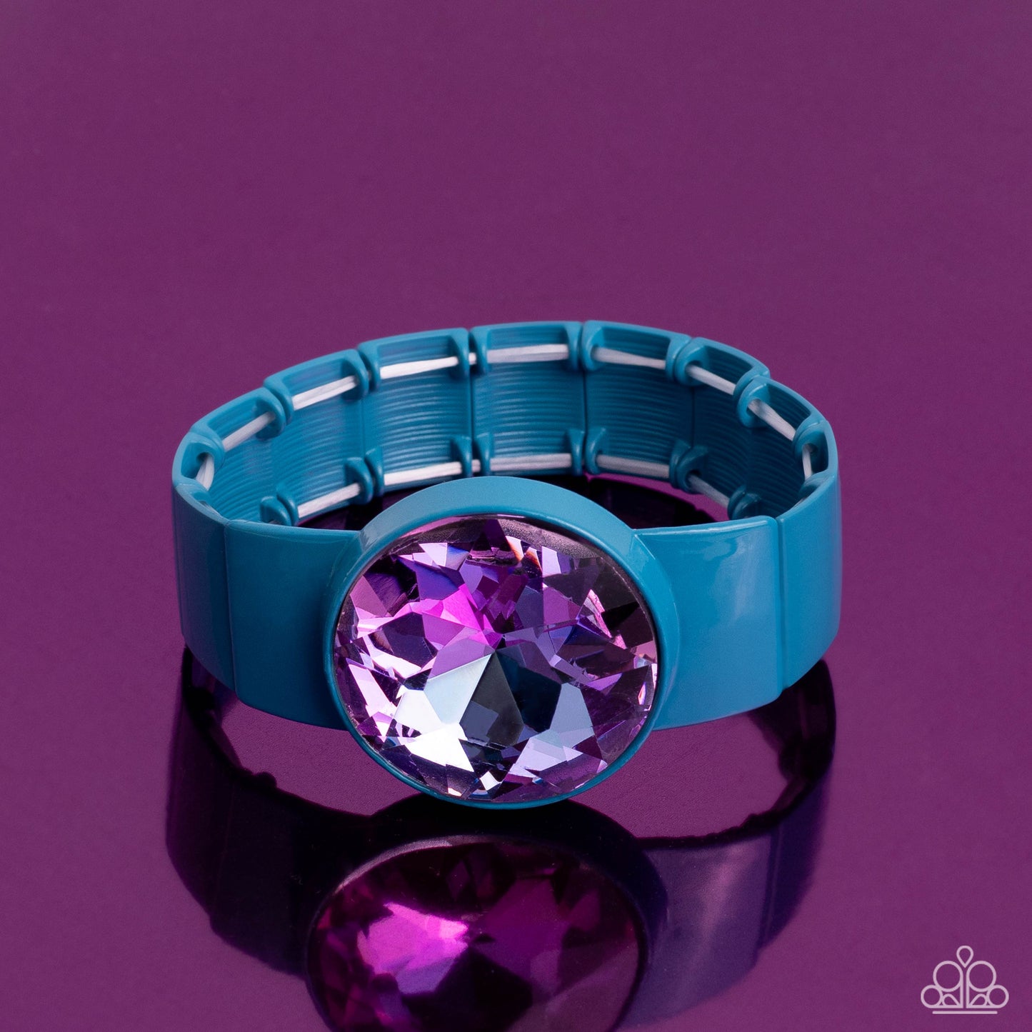 Paparazzi Accessories Exaggerated Ego - Blue Featuring a UV shimmer, an exaggerated purple gem is pressed into a metallic blue fitting along bold rectangular frames around the wrist on stretchy bands for a colorful summer look. Sold as one individual brac