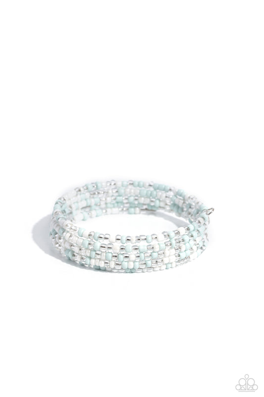 Paparazzi Accessories Coiled Candy - White Row after row of pearly white, clear, and light blue seed beads coil around the wrist, creating a charismatic infinity wrap style bracelet. Sold as one individual bracelet Jewelry