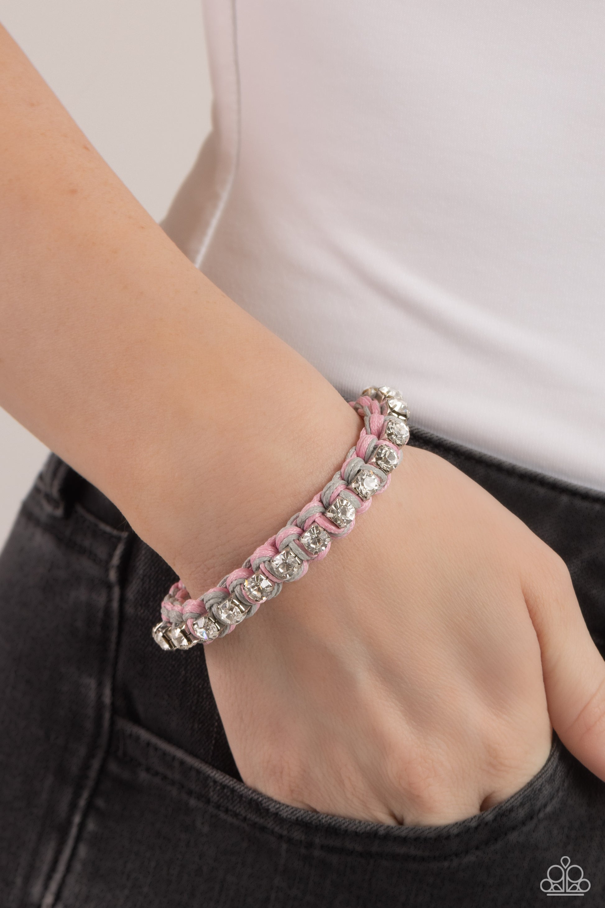 Paparazzi Accessories The Next Big STRING - Silver Strands of gray and pink cording ornately weave across the wrist, creating an earthy braid. Sporadically dotted through the cording, white rhinestones, set in silver square fittings add a bit of lively da
