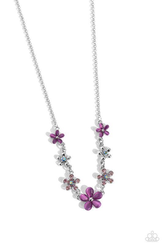 Paparazzi Accessories Spring Showcase - Purple Purple cat's eye stone petals bloom from silver stud centers, linking into various sizes of ethereal blossoms below the collar on a dainty silver chain. Silver-studded petals bloom from blue iridescent rhines
