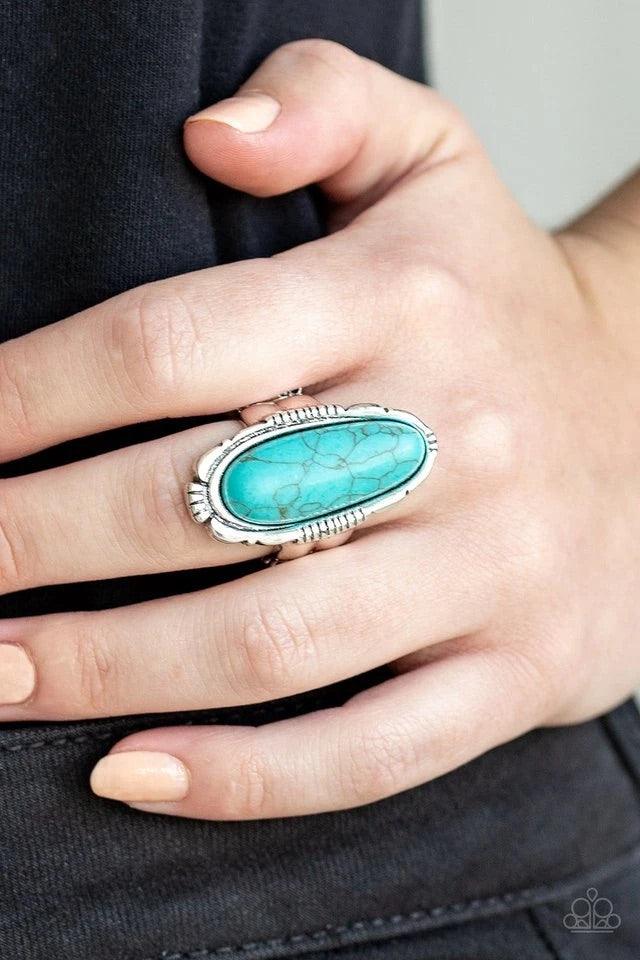 Paparazzi Accessories Desert Thirst - Blue An oblong turquoise stone is pressed into the center of an ornate silver frame for a seasonal look. Features a stretchy band for a flexible fit. Sold as one individual ring. Jewelry