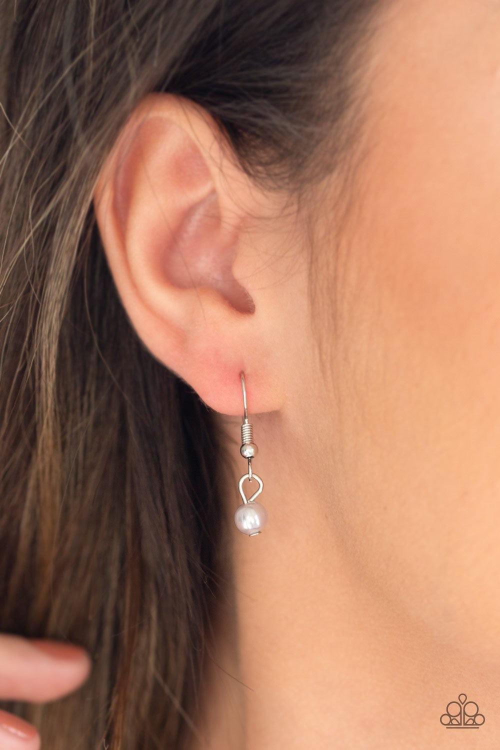 Paparazzi Accessories Really Refined - Silver *Lanyard A collection of pearly silver, twisting silver hoops, and faceted silver beads trickle along an asymmetrical silver chain for a refined look. A lobster clasp hangs from the bottom of the design to all