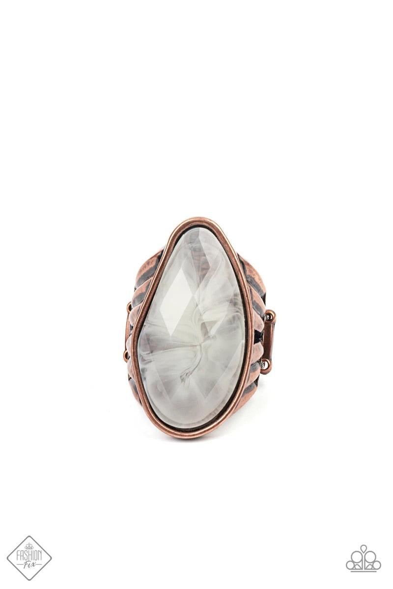 Paparazzi Accessories Magically Mystified - Copper Featuring an asymmetrical cut, a large cloudy faux stone bead is pressed into an asymmetrical copper frame that is held up by the illusion of flared copper bar fittings. Features a stretchy band for a fle