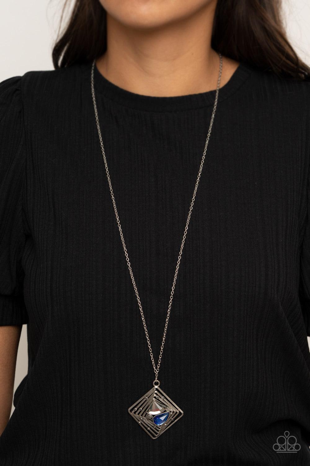 Paparazzi Accessories Timelessly Tilted - Blue Dotted with dainty hematite rhinestones, textured silver bars twist and ripple into a stacked square frame. An abstract collection of round hematite, teardrop blue, and diamond shaped smoky rhinestones embell