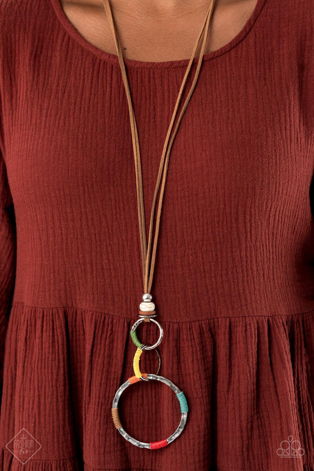 Paparazzi Accessories Rural Renovation - Multi Wrapped in sections of multicolored threaded accents, a mismatched trio of hammered silver rings link at the bottom of a beaded fitting. The earthy compilation is attached to lengthened strands of brown suede