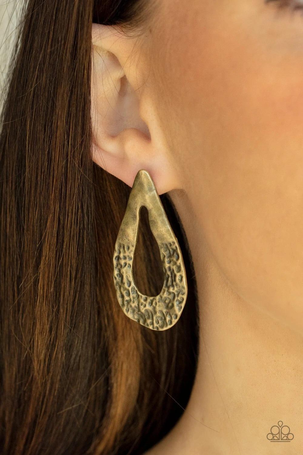Paparazzi Accessories Industrial Antiquity - Brass The bottom of a warped brass teardrop frame is hammered in rustic details, creating a tactile display. Earring attaches to a standard post fitting. Sold as one pair of post earrings. Jewelry