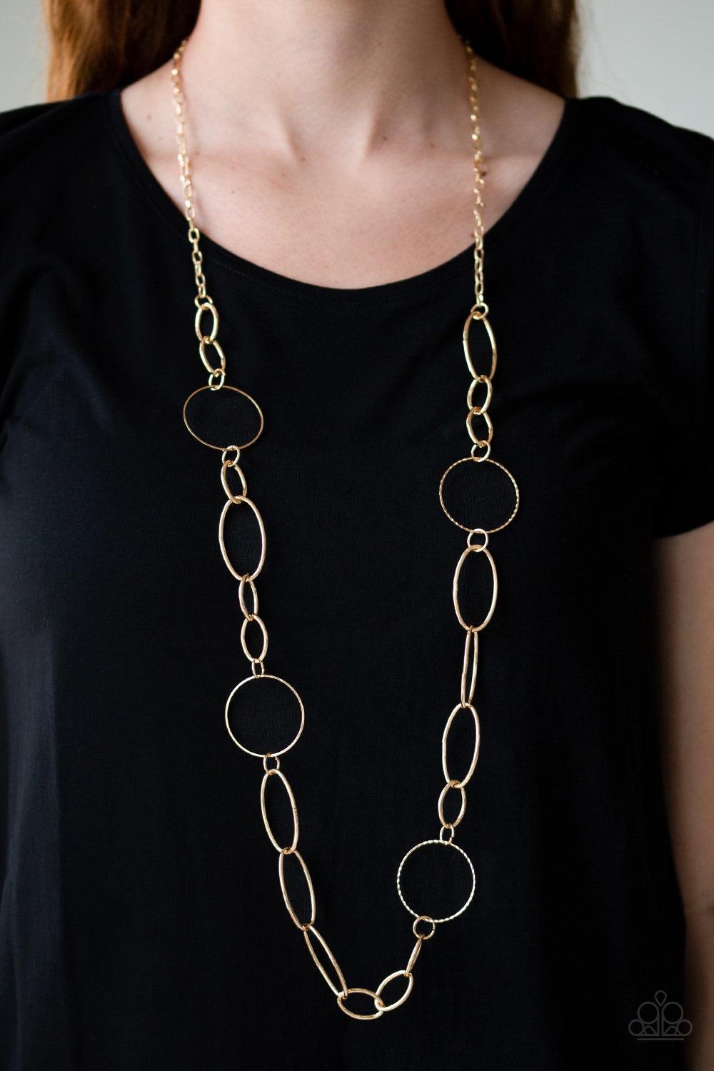 Paparazzi Accessories Perfect MISMATCH - Gold An array of smooth and textured gold hoops connect across the chest, creating a bold mismatched palette. Features an adjustable clasp closure. Jewelry