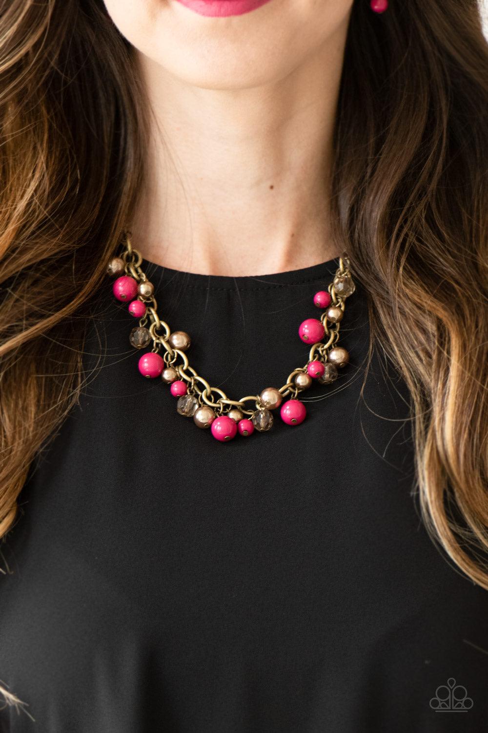 Paparazzi Accessories The GRIT Crowd - Pink Pearly brass, polished pink, and glittery crystal-like beads swing from a bold brass chain, creating a refined fringe below the collar. Features an adjustable clasp closure. Jewelry