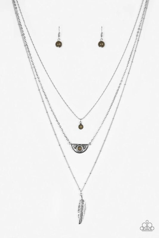 Paparazzi Accessories Sahara Sparrow - Green Featuring indigenous inspired pendants, mismatched silver chains layer down the chest for a seasonal look. Featuring earthy green beaded accents, dainty silver frames give way to a lifelike silver feather penda