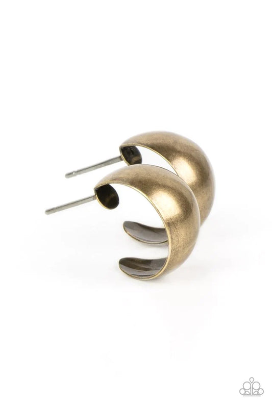 Paparazzi Accessories Burnished Beauty - Brass A thick bar of brass curls around the ear into a fashionable hoop. The dramatic curvature of the hoop is heightened by its high sheen finish, making a lasting impression. Earring attaches to a standard post f