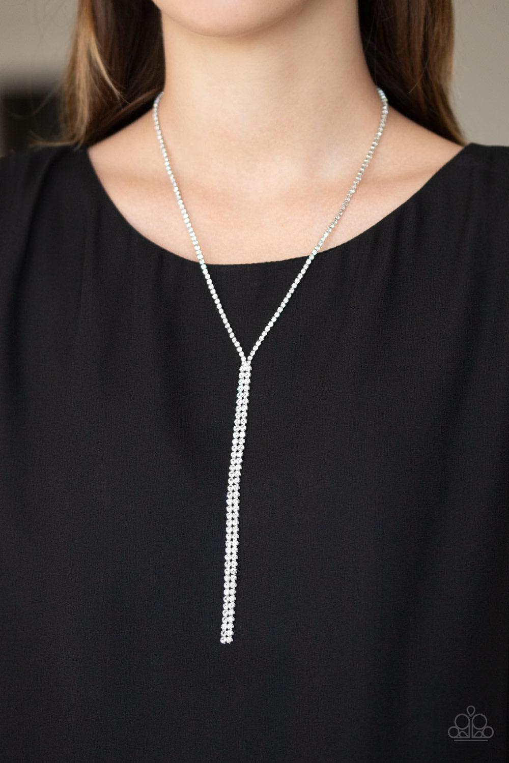 Paparazzi Accessories Inner STARLIGHT - White Featuring square silver fittings, a dainty strand of glassy white rhinestones drapes around the neck. The glittery strands delicately connect, splitting off into two twinkling tassels down the chest. Features
