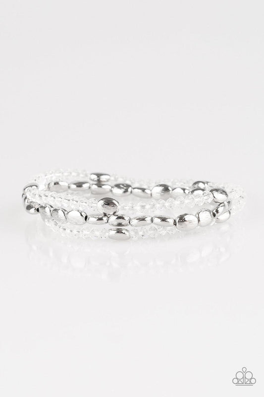 Paparazzi Accessories Hello Beautiful - White Infused with hints of silver, dainty white crystal-like beads are threaded along stretchy bands, creating whimsical layers across the wrist. Sold as one set of three bracelets. Jewelry