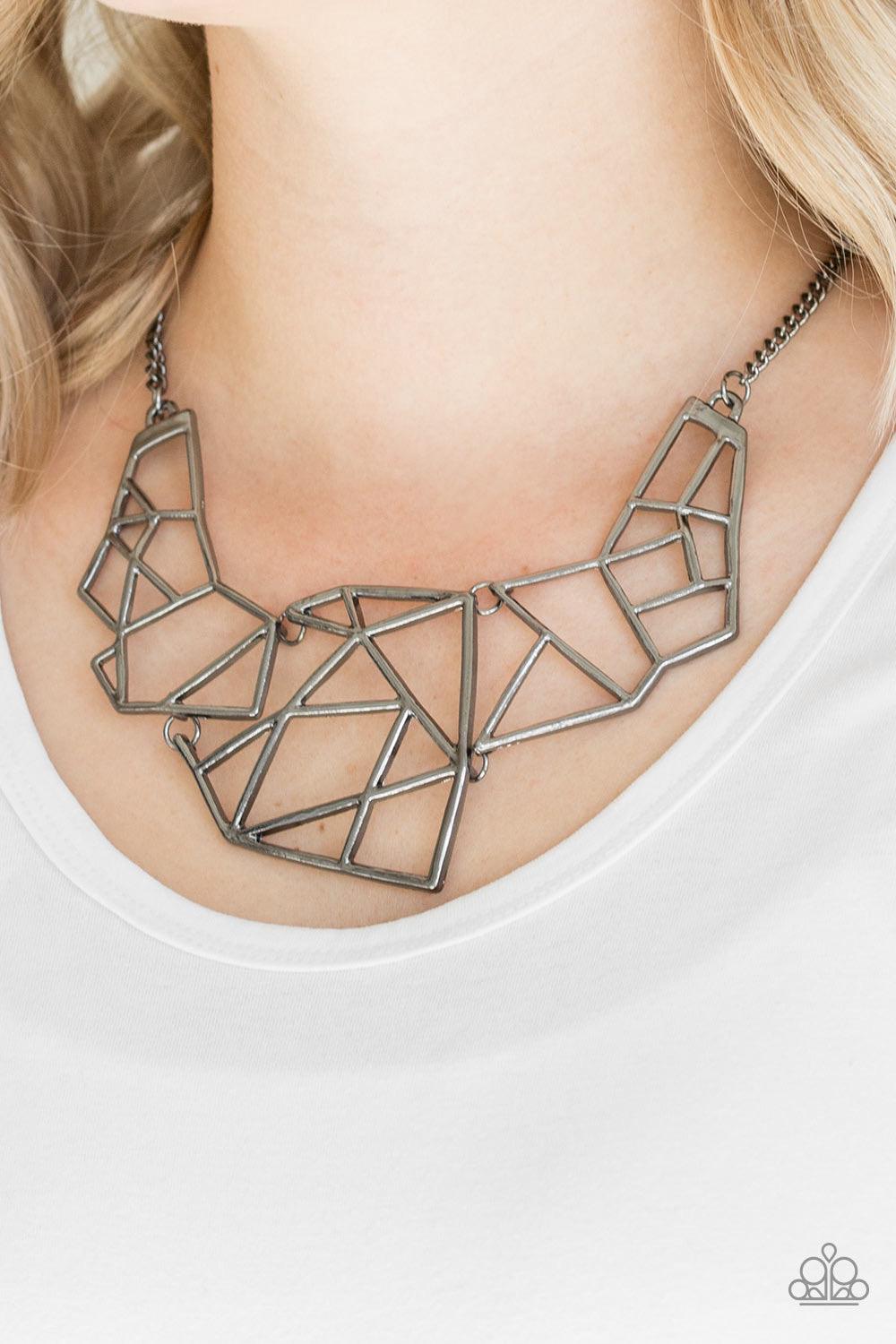 Paparazzi Accessories World Shattering - Black Shattered gunmetal plates link below the collar, coalescing into an edgy geometric pendant. Features an adjustable clasp closure. Sold as one individual necklace. Includes one pair of matching earrings. Jewel