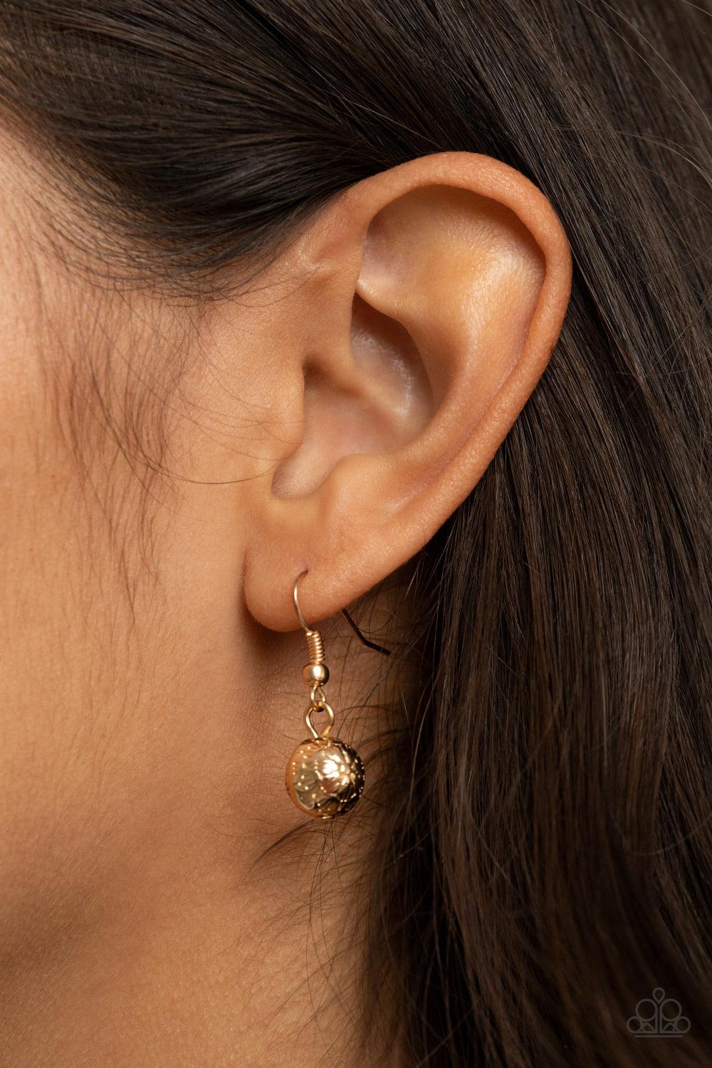 Paparazzi Accessories SEA The Sights - Gold A dainty collection of ornate gold beads and white stone beads dot a dainty gold chain, giving way to a hammered gold ring featuring a shell-like center. A hammered gold disc and white shell-like disc swing from