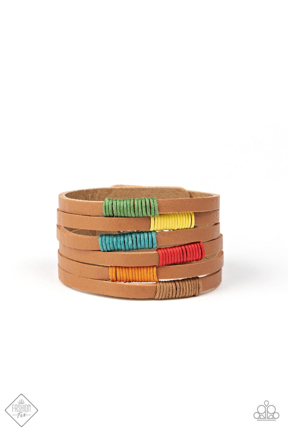 Paparazzi Accessories Country Colors - Multi A brown leather band has been spliced into layered rows that wrap around the wrist. Multicolored threaded accents wrap around the leather strips, creating a colorfully rustic display. Features an adjustable sna