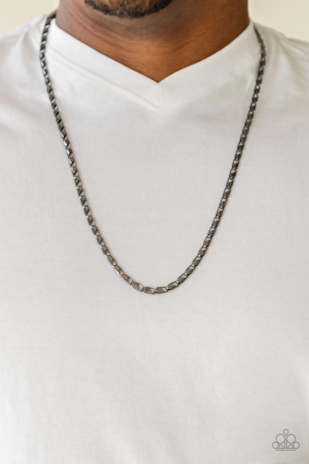 Paparazzi Accessories Free Agency - Black Featuring clasp-like links, an ornate gunmetal chain drapes across the chest for a causal look. Features an adjustable clasp closure. Jewelry