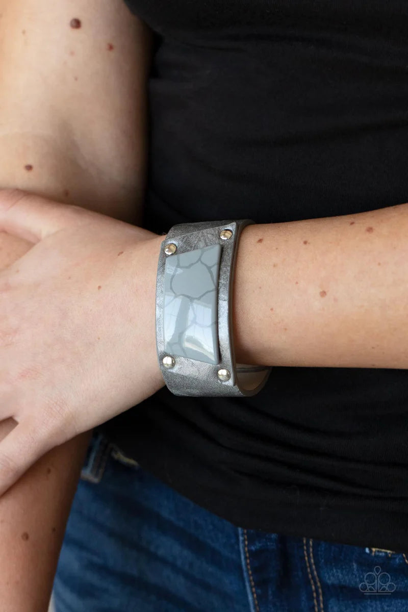 Paparazzi Accessories Geo Glamper - Silver Featuring a faux marble finish, an Ultimate Gray acrylic centerpiece attaches to a silvery leather frame that is studded in place along a distressed silver and gray leather band for a colorfully rustic fashion. F