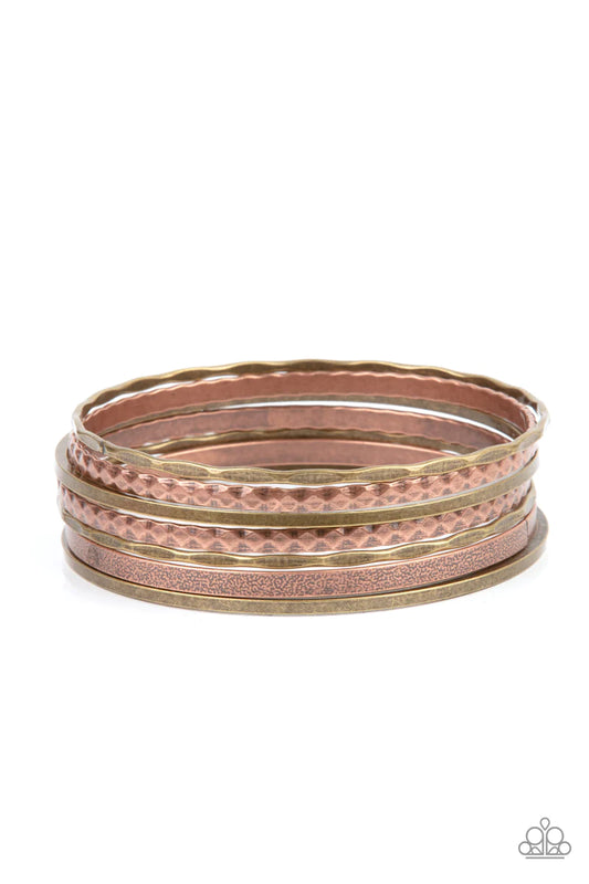 Paparazzi Accessories How Do You Stack Up? - Multi Varying in hammered, diamond-cut, and shiny finishes, a collection of mismatched copper and brass bangles stack across the wrist for an intense industrial look. Sold as one set of seven bracelets. Jewelry