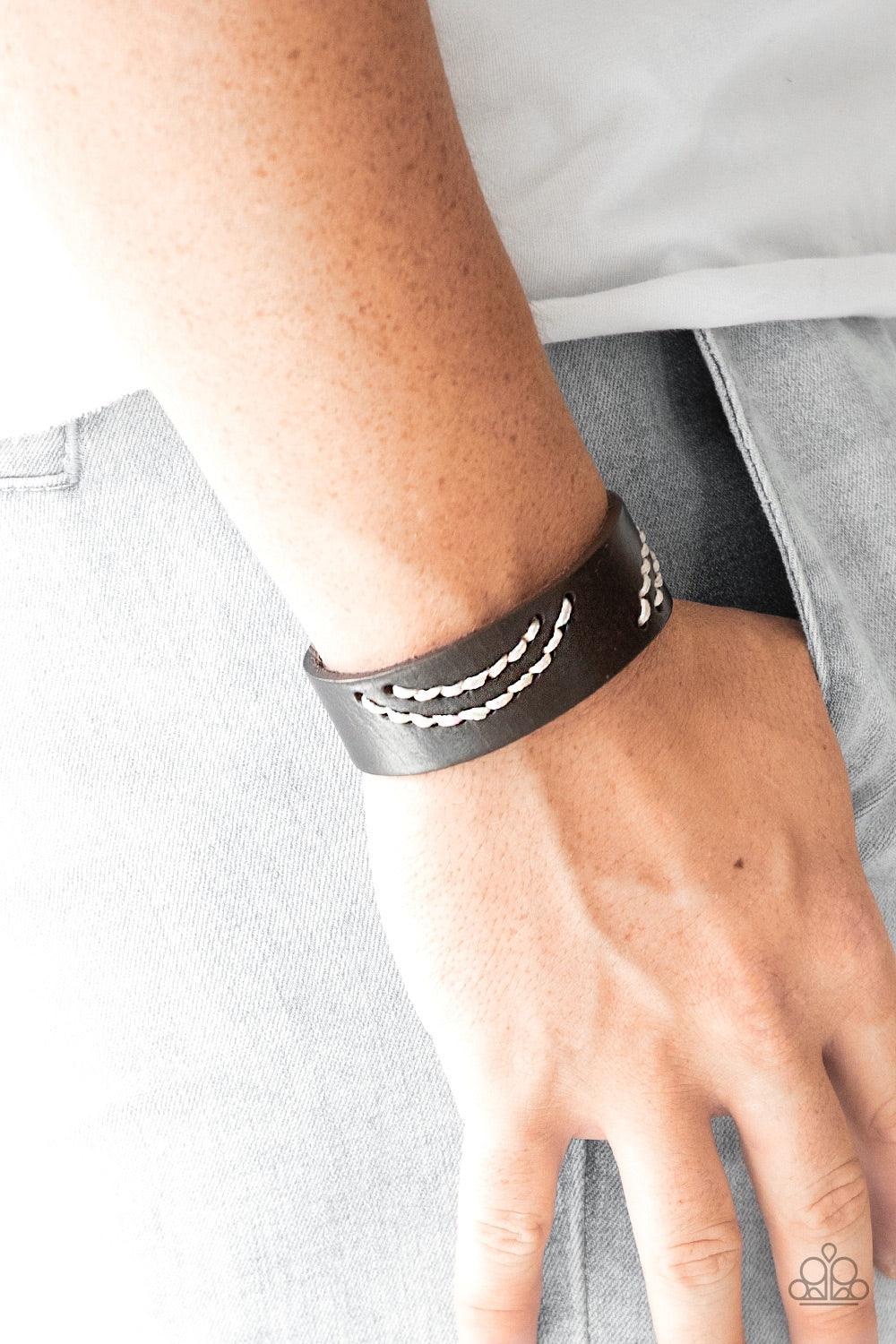 Paparazzi Accessories Rural Roamer - Brown Sections of white cording is stitched across the front of a brown leather band for a whimsical look. Features an adjustable snap closure. Jewelry