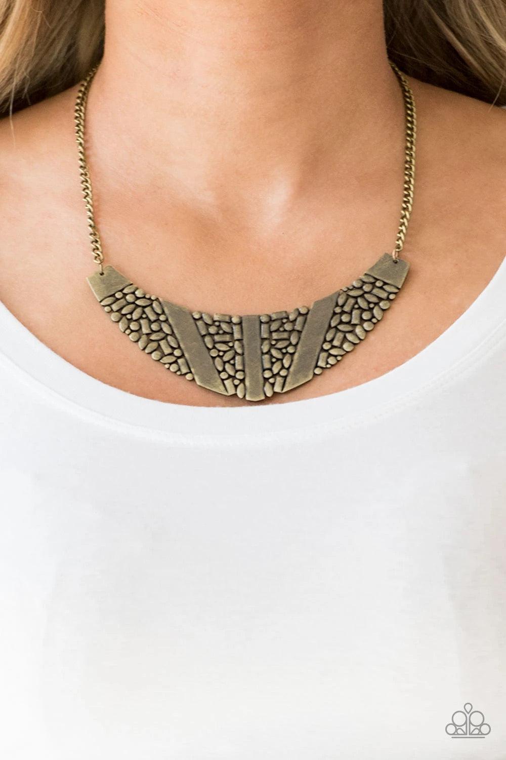 Paparazzi Accessories Terra Trailbreaker - Brass Varying in shape, a collection of dainty brass frames coalesce into a striking crescent pendant below the collar for a statement making look. Features an adjustable clasp closure. Sold as one individual nec