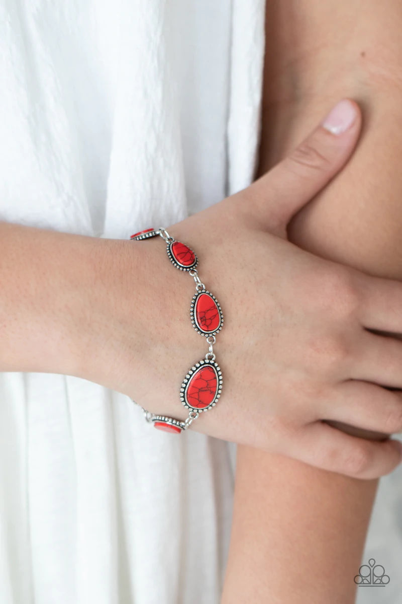 Paparazzi Accessories Elemental Exploration- Red Encased in frames of flattened silver studs, pieces of flat red stone teardrops gradually increase in size as they link around the wrist for an artisan inspired look. Features an adjustable clasp closure. S