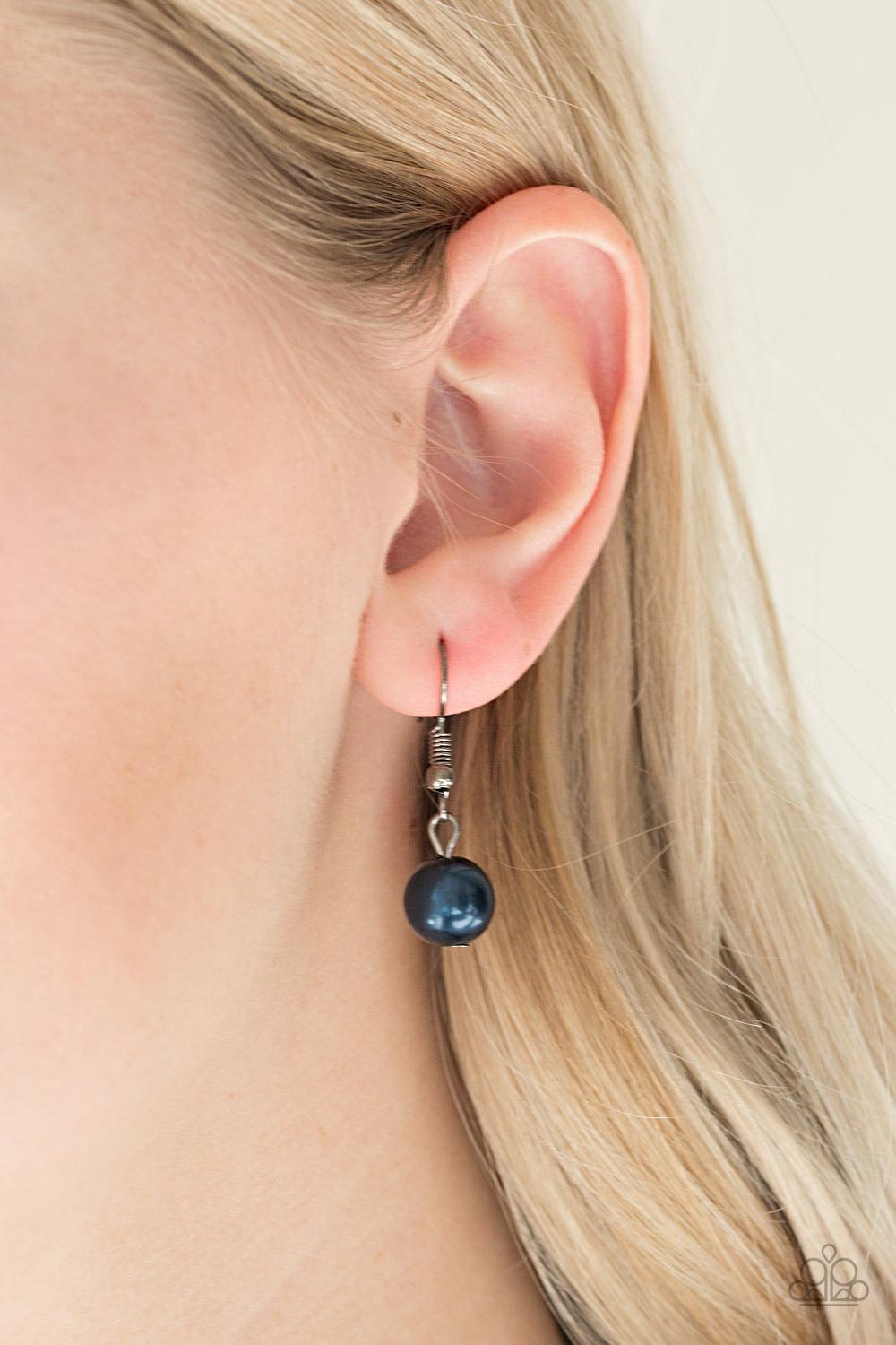 Paparazzi Accessories Color Me CEO - Blue Dusted in glitter, sparkling gunmetal and pearly blue beads are threaded along an invisible wire below the collar for a glamorous look. Features an adjustable clasp closure. Sold as one individual necklace. Includ