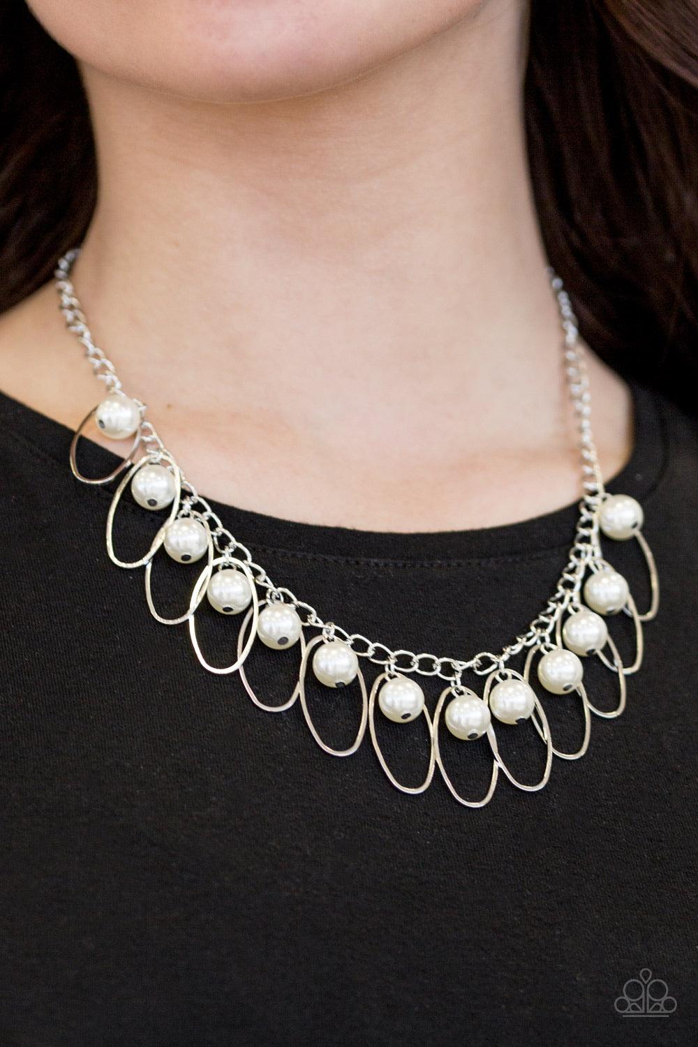 Paparazzi Accessories Party Princess - White Pearly white beads and shimmery silver hoops trickle from the bottom of a glistening silver chain, creating a fierce fringe below the collar for a timeless look. Features an adjustable clasp closure. Sold as on