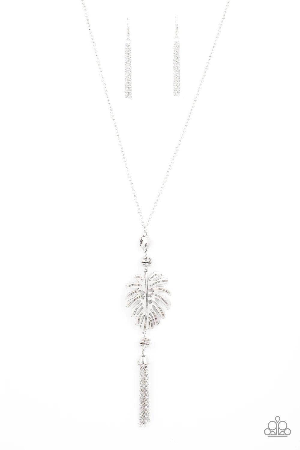 Paparazzi Accessories Palm Promenade - Silver Infused with silver beaded accents, a lifelike silver palm leaf frame attaches to the bottom of a shimmery silver chain. A silver chain tassel swings from the bottom, adding flirtatious movement to the summery