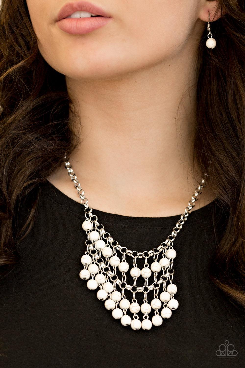 Paparazzi Accessories Jurassic Park Party - White Refreshing white stone beads swing from the bottom of a netted silver chain, creating a bold artisanal fringe below the collar. Features an adjustable clasp closure. Sold as one individual necklace. Includ