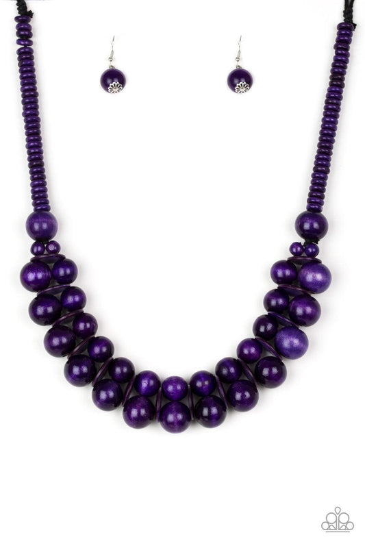 Paparazzi Accessories Caribbean Cover Girl - Purple Brushed in a distressed finish, vivacious purple wooden beads and discs join below the collar for a summery look. Features a button loop closure. Jewelry