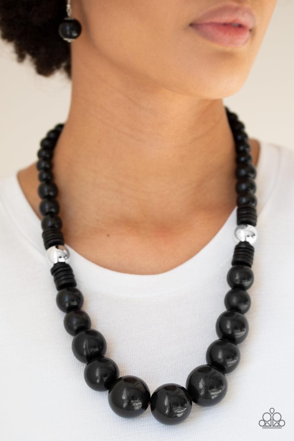Paparazzi Accessories Panama Panorama - Black Infused with dramatic silver beads, an array of shiny black wooden beads drape across the chest for a summery look. Features a button-loop closure. Jewelry