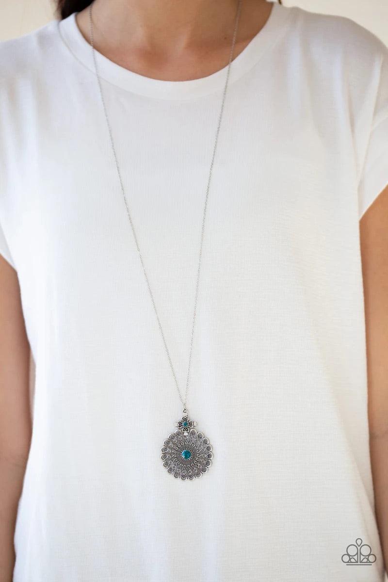 Paparazzi Accessories Walk On The WILDFLOWER Side - Blue Filigree filled petals flare from a glittery blue rhinestone center, creating a whimsical floral pendant at the bottom of a lengthened silver chain. Features an adjustable clasp closure. Sold as one