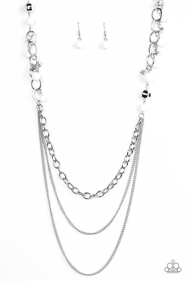 Paparazzi Accessories Carefree And Capricious - White Polished white and faceted silver beads trickle along shimmery silver hoops for an asymmetrical look. The colorful beading gives way to layers of shimmery silver chain for a seasonal finish. Features a