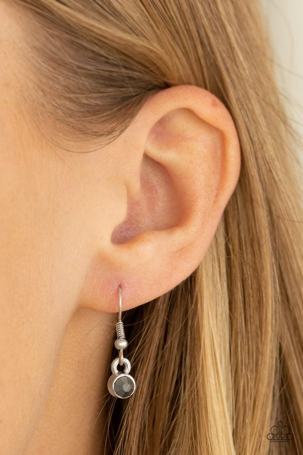 Paparazzi Accessories Got It On Lock - Silver Dotted with a glittery hematite rhinestone, a vintage inspired key pendant swings from the bottom of an elegantly elongated silver chain for a whimsical look. Features an adjustable clasp closure. Jewelry