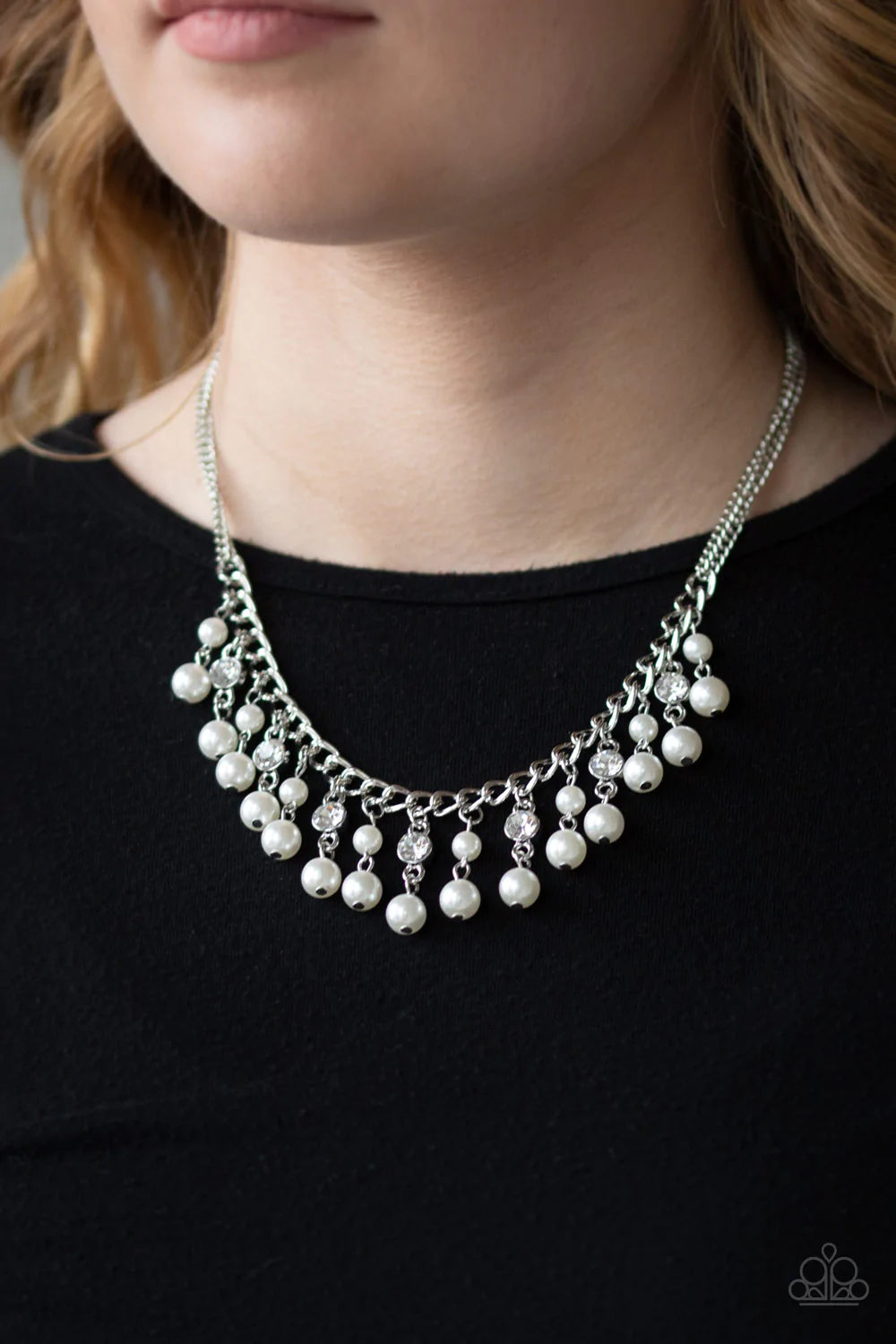 Paparazzi Accessories Regal Refinement - White Alternating with glassy white rhinestones, pearly white beaded tassels swing from the bottom of a shimmery silver chain below the collar for a refined flair. Features an adjustable clasp closure. Sold as one